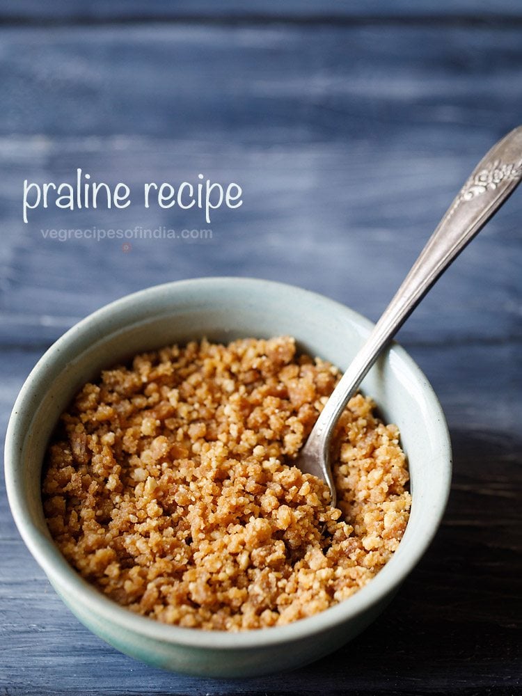 praline served in a bowl with a brass spoon.