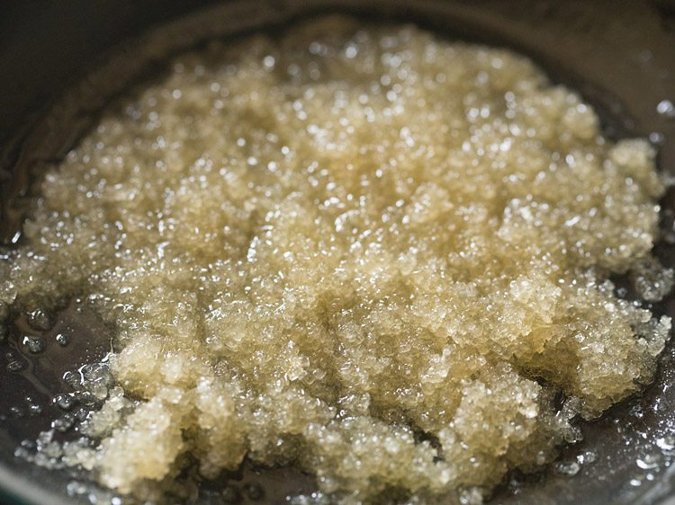 mixing the sugar with the butter in pan