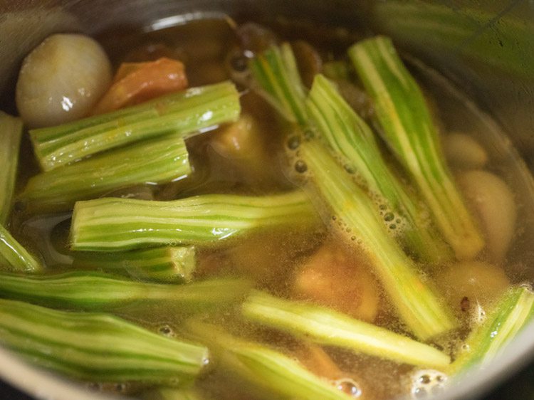 drumsticks, tomatoes, onions, water and turmeric 