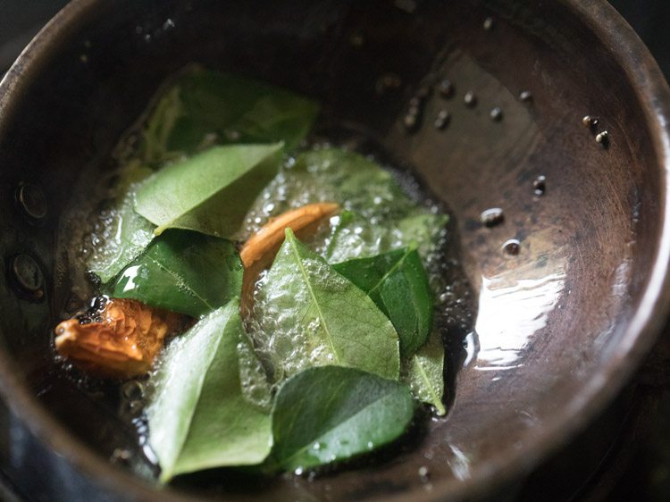 red chilies, fenugreek seeds and curry leaves