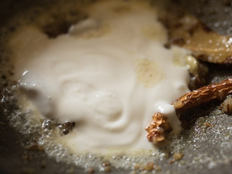 whisked curd added to the pan after switching off heat. 