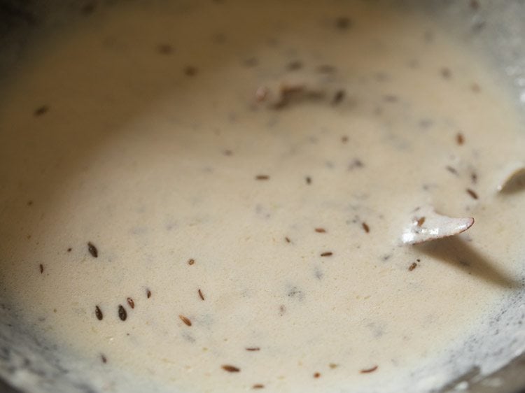 curd mixed well with the sautéed onion paste. 