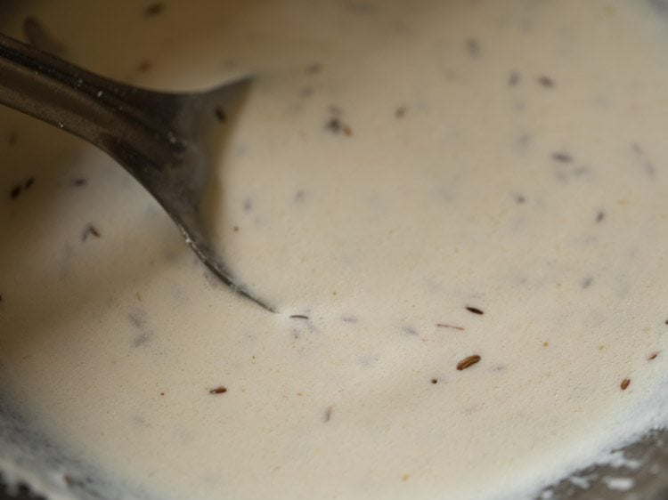 stirring and cooking curd. 