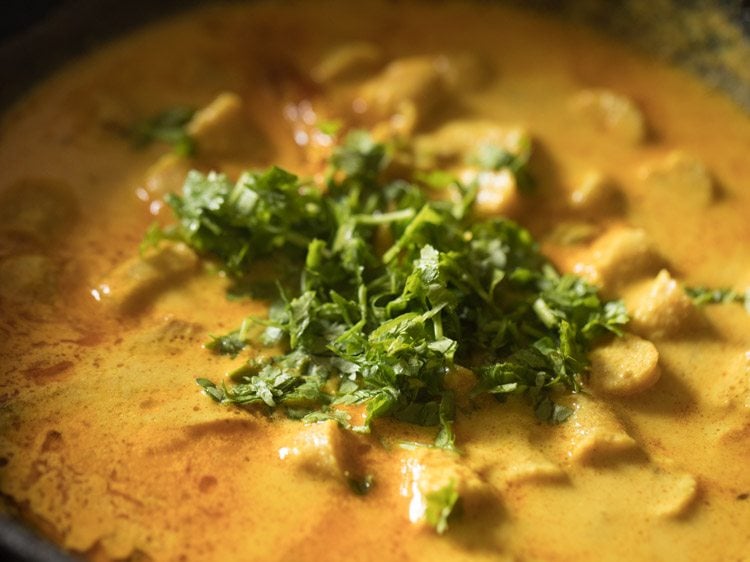 chopped coriander leaves added to cooked gatte ki sabji. 