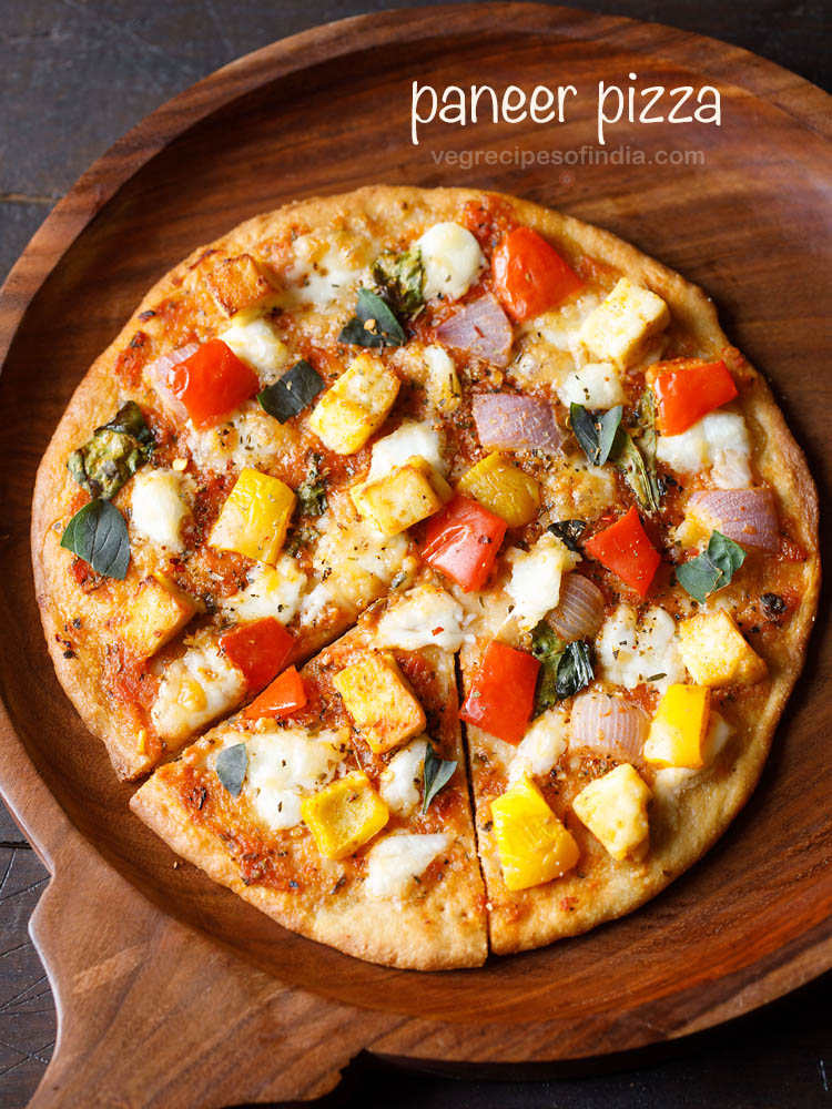 homemade paneer pizza served on a wooden board with text layover.