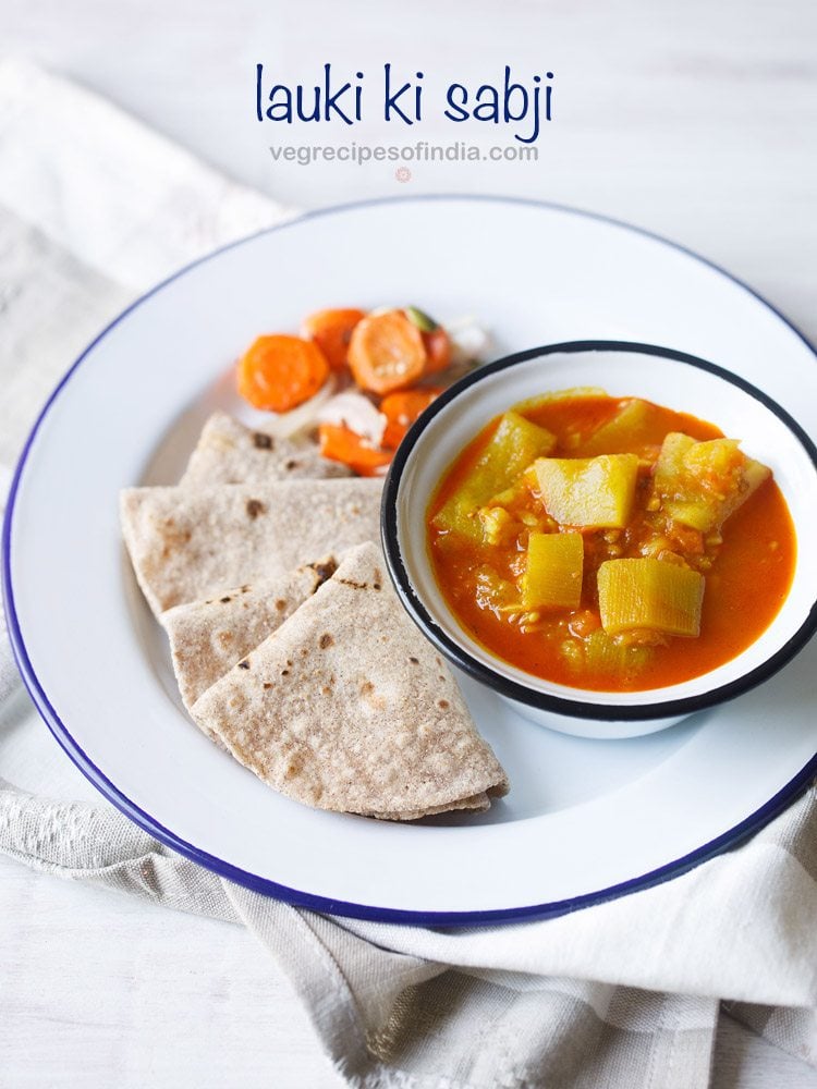 lauki ki sabji served in a blue rimmed bowl kept on a blue rimmed white plate with chapattis kept on the left side and salad kept on the top side on the plate with text layover.