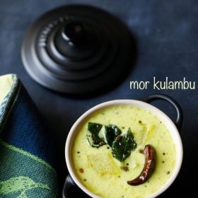mor kulambu served in a black casserole with text layover.