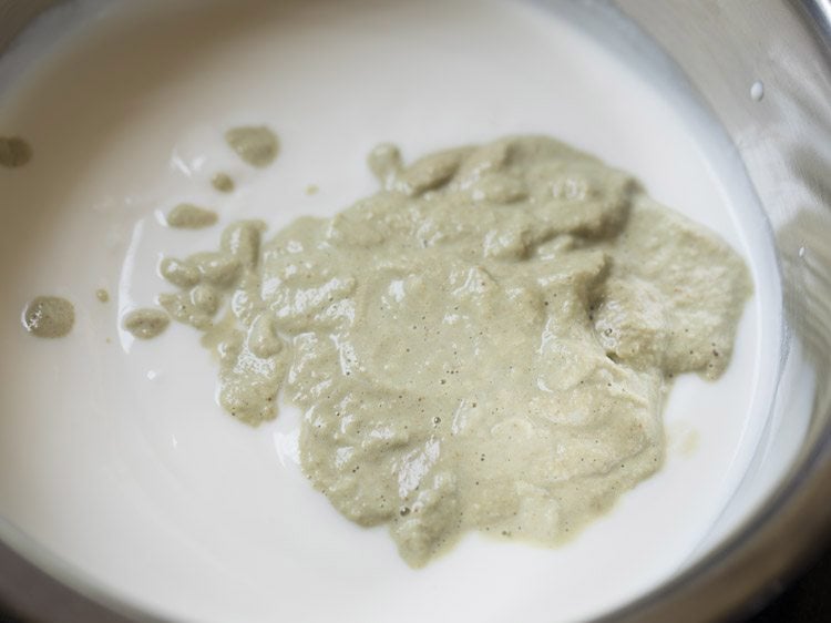 prepared paste added to beaten curd for mor kuzhambu. 