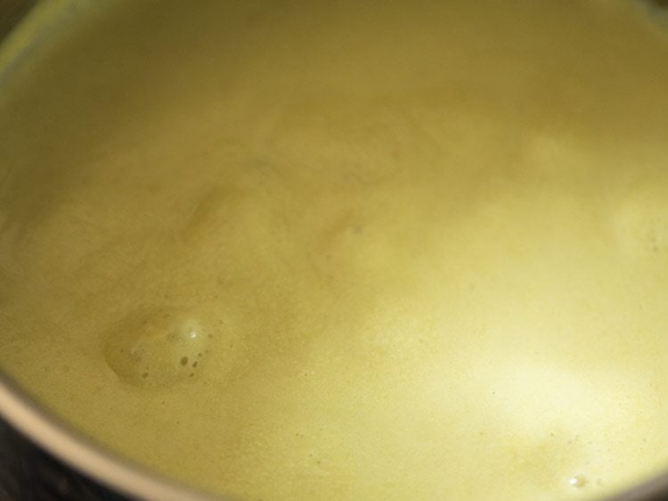 boiling mor kulambu curry. 
