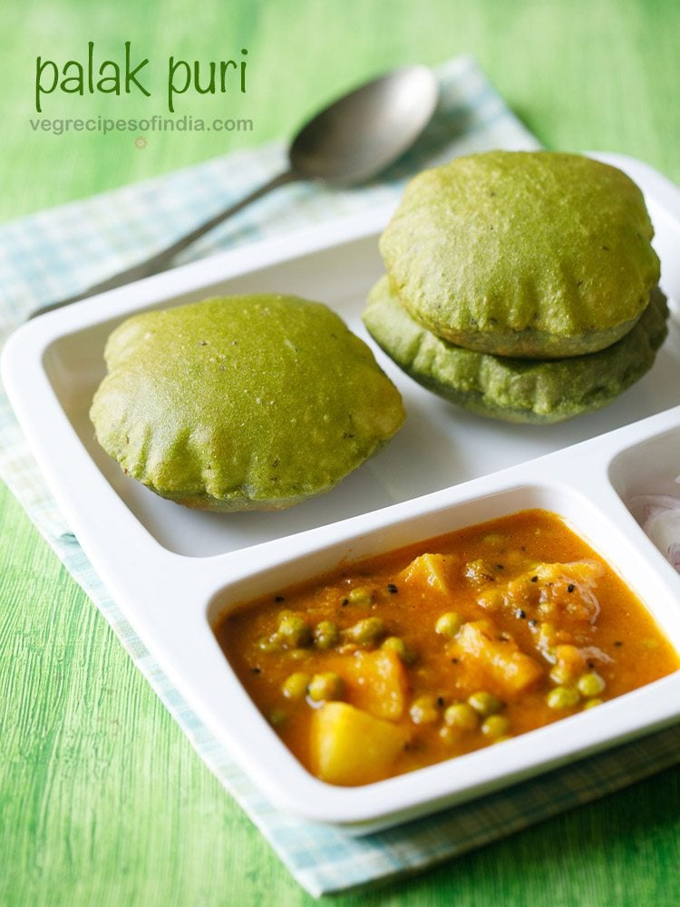 palak poori served with aloo matar gravy in a white plate