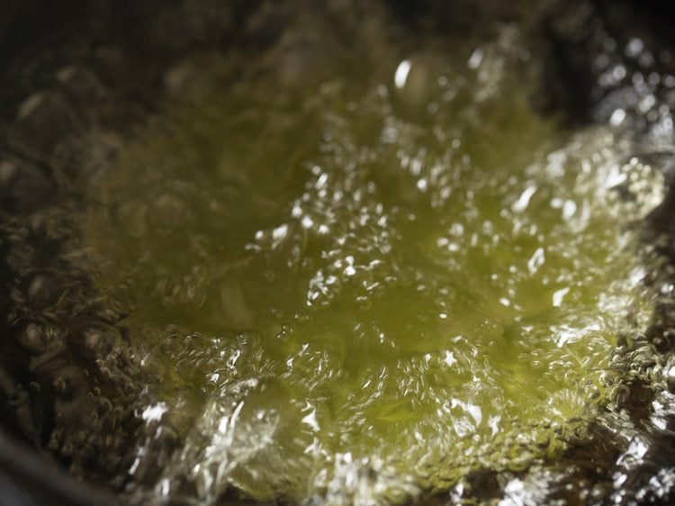 frying palak poori in hot oil