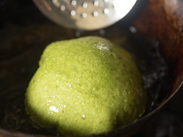 frying palak poori in hot oil