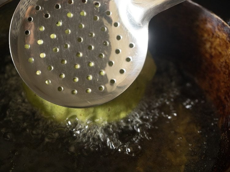 frying palak poori in hot oil