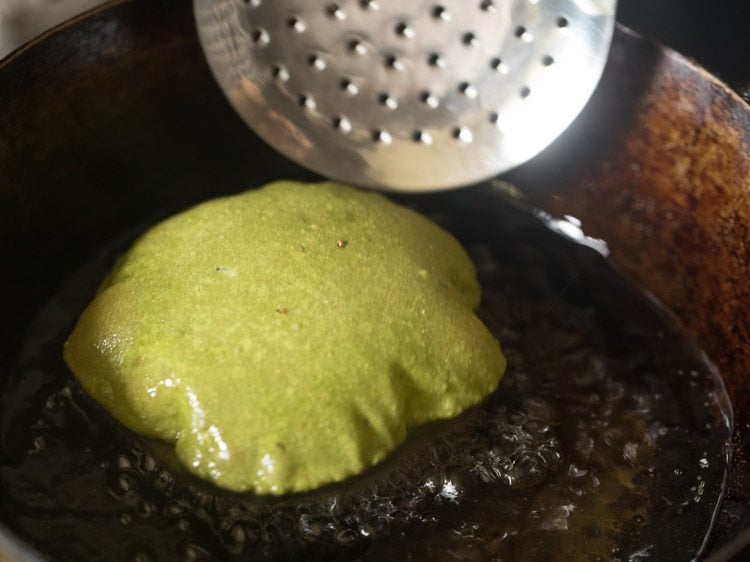 frying palak poori in hot oil