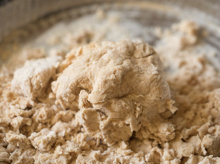 kneading the dough in the tray. 