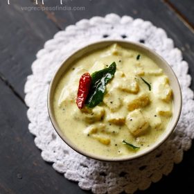 pineapple pachadi in cream colored bowl placed on top of a white doily.