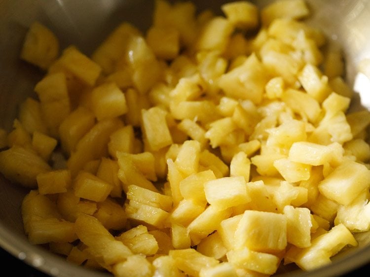 small bits of pineapple in a pan.