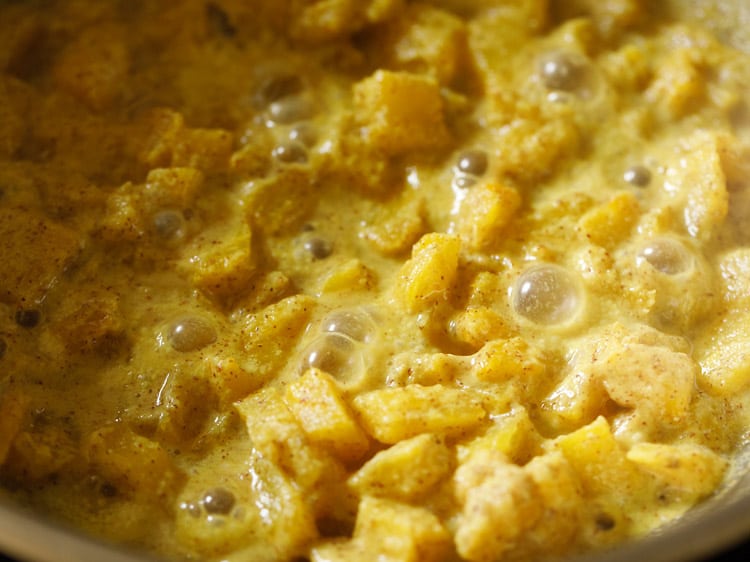 simmering pineapple pachadi mixture.