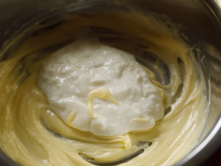 fresh chilled curd added to whisked ghee for making badusha. 