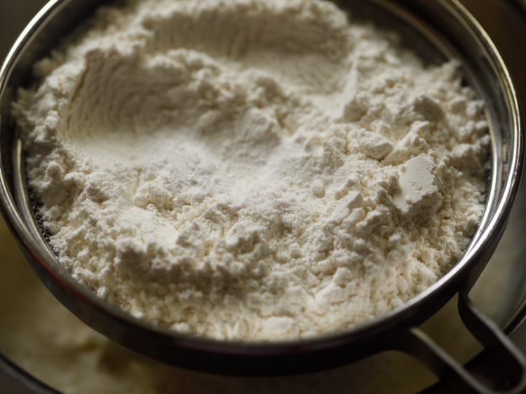salt, baking soda and baking powder added to the flour for making badusha. 