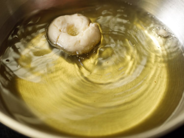 adding badusha sweet in hot oil.