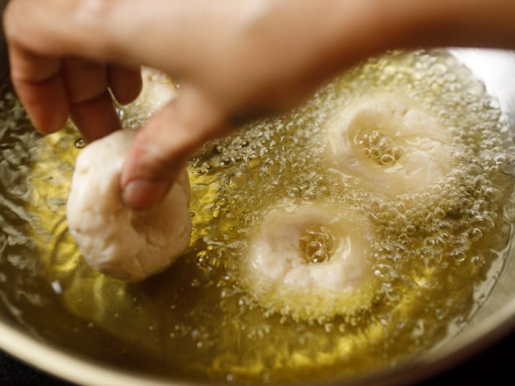 adding badusha sweet in hot oil.