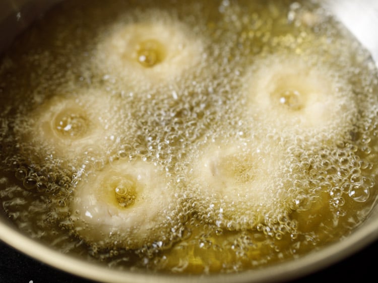 frying badusha sweet in hot oil.