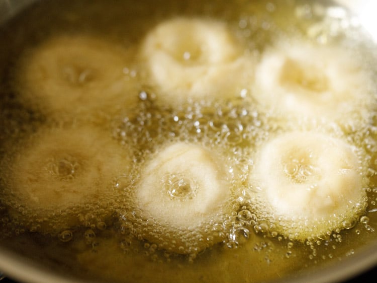 frying badusha sweet in hot oil.