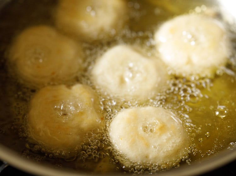 frying badusha sweet in hot oil.