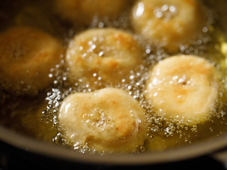 frying badusha sweet in hot oil.