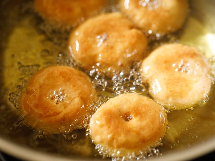 frying balushahi recipe in hot oil.