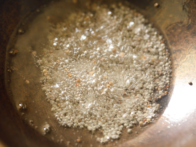 mustard seeds crackling in hot oil. 