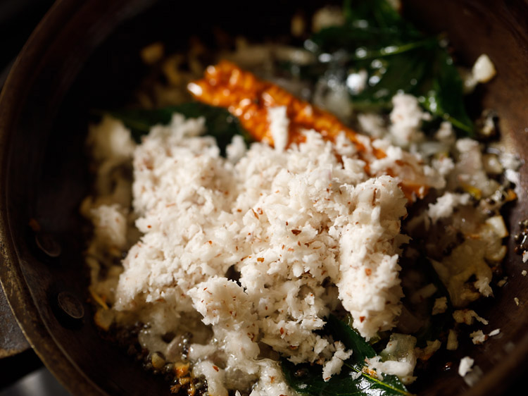 fresh grated coconut added to pan. 