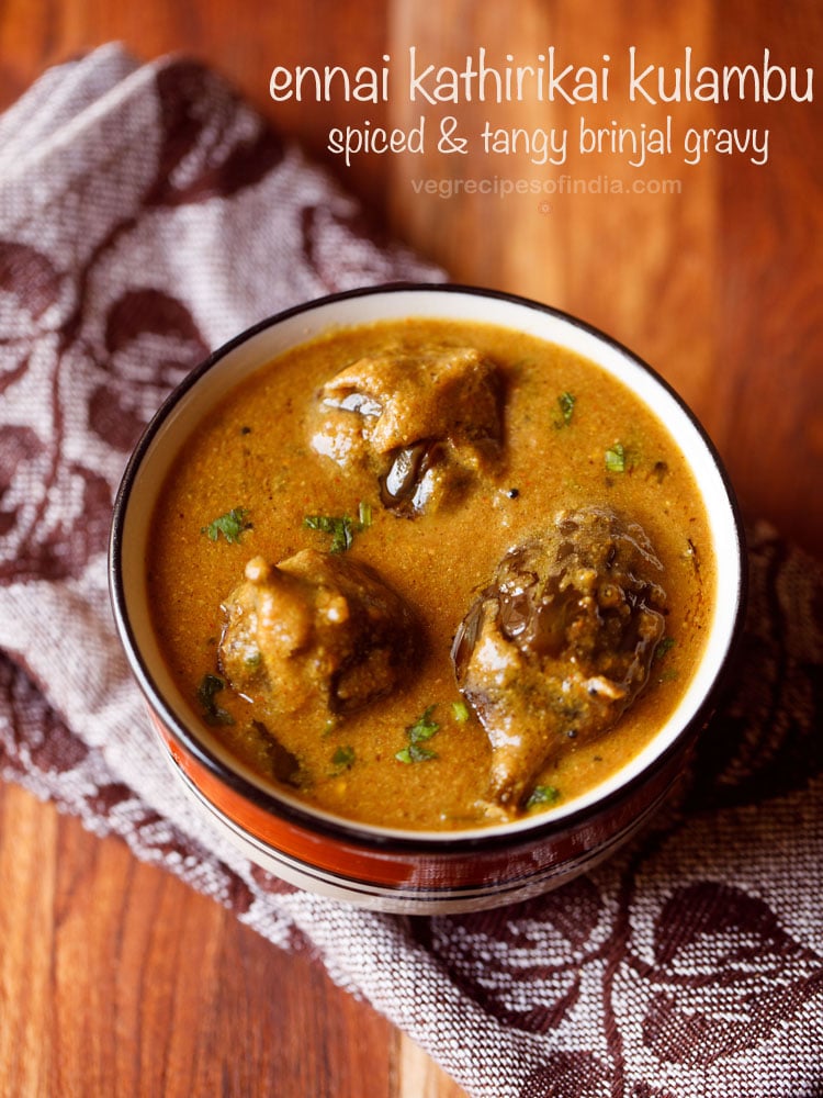 ennai kathirikai kulambu garnished with chopped coriander leaves and served in a black rimmed bowl with text layovers.