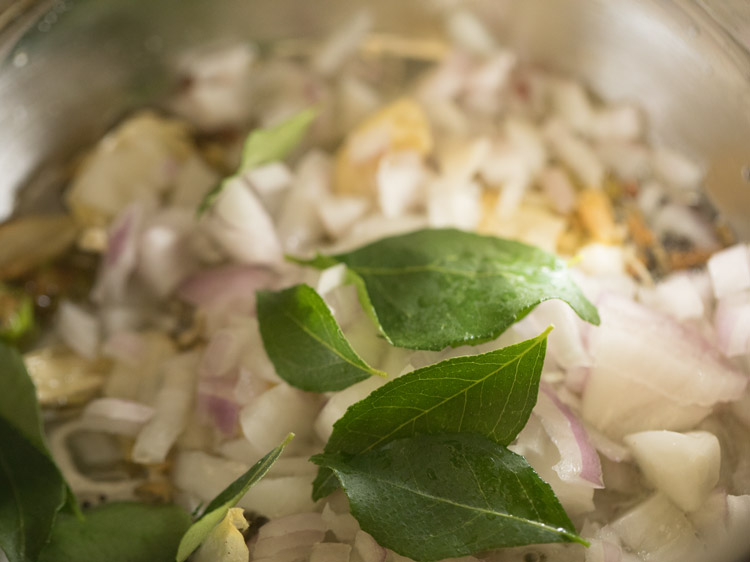 chopped onions and curry leaves added in the pan. 