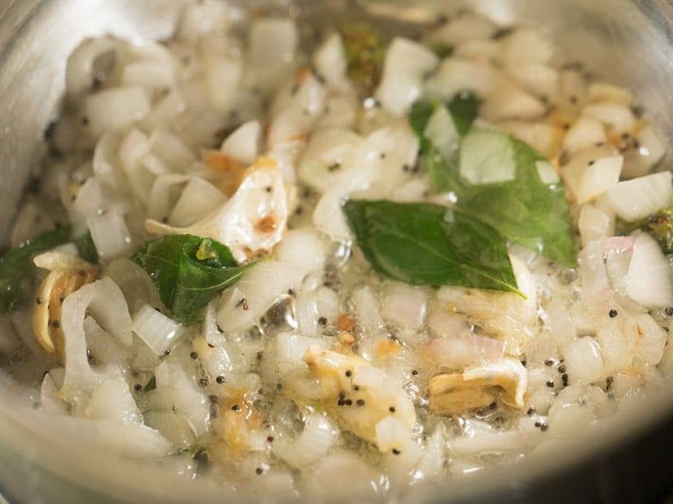 sautéing onions in the pan. 