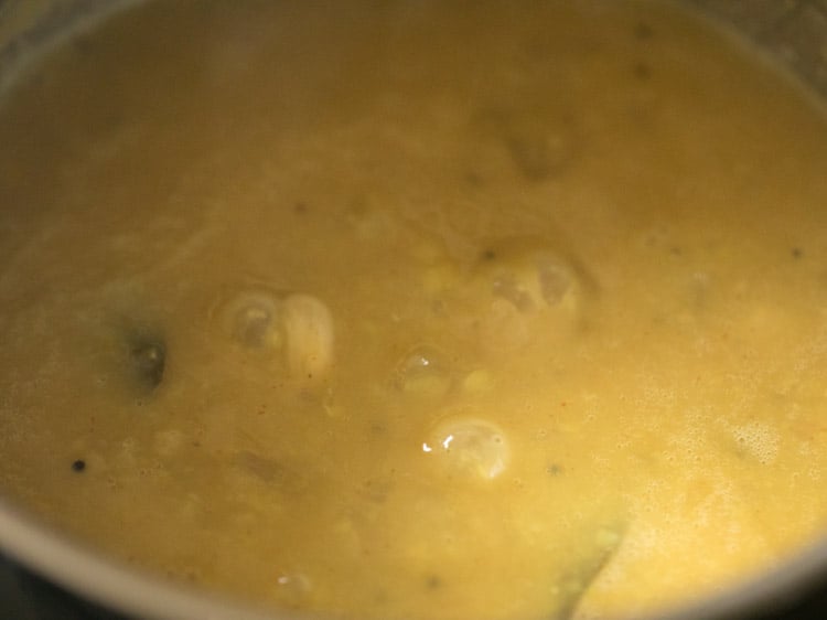 cooking mamidikaya pappu in the pan. 