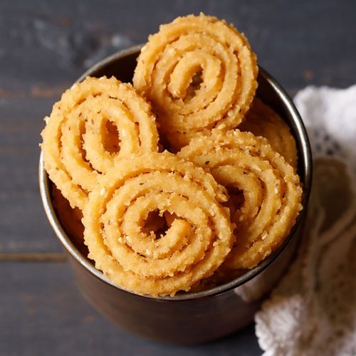 four murukku pieces in a metal jar