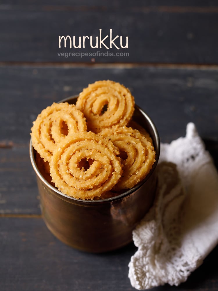 murukku served in a metal jar with text layovers.