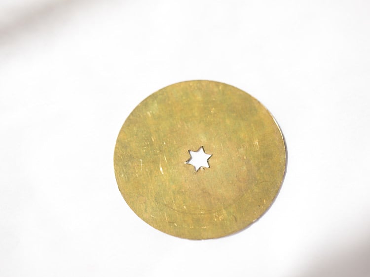 star shaped disc of murukku maker greased with some oil. 
