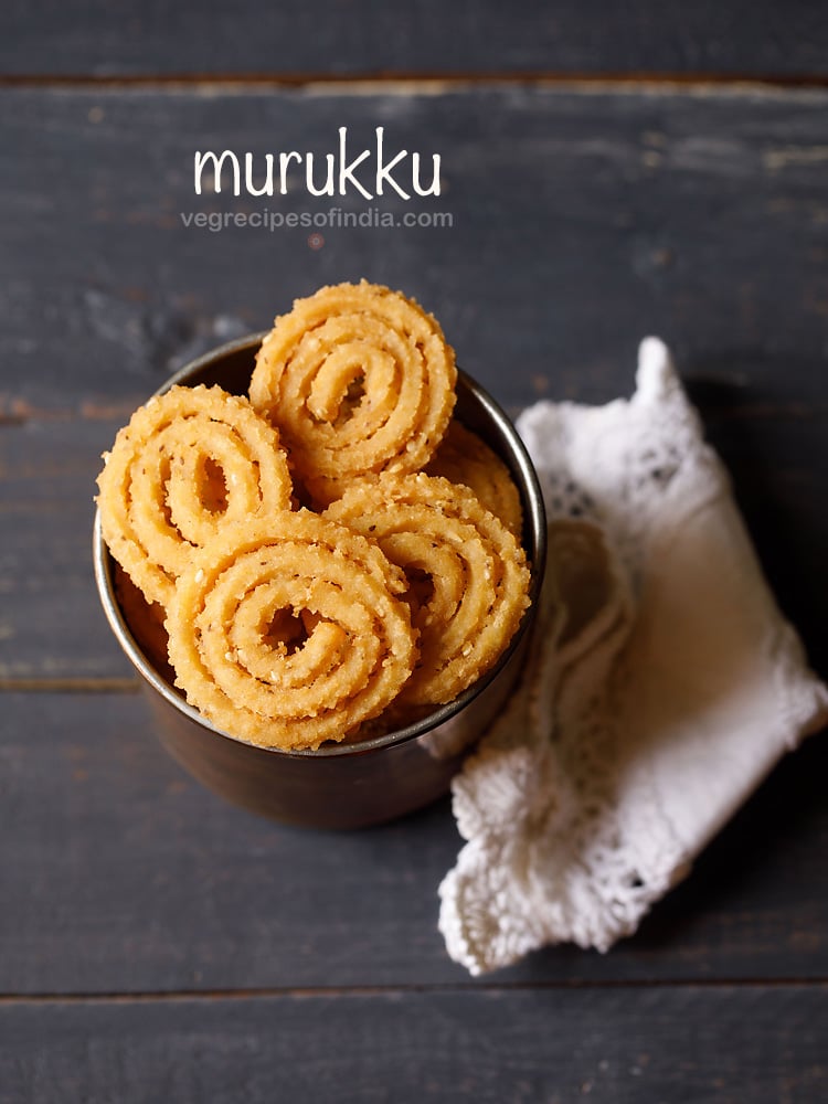 murukku served in a metal jar with text layovers.