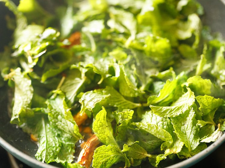 mint leaves added to the pan. 