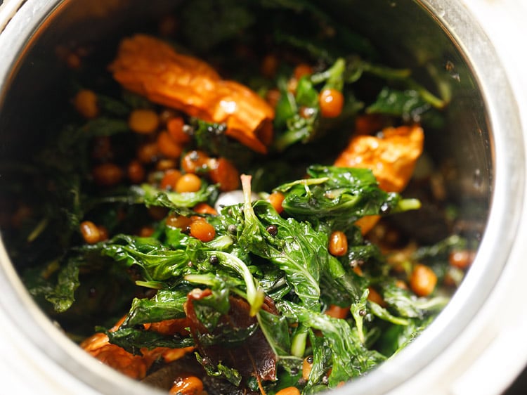 fried ingredients added in a grinder jar. 