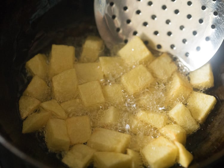 chopped potatoes frying