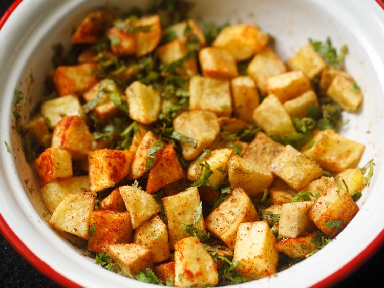 potatoes mixed and tossed with spices, mint, coriander and salt