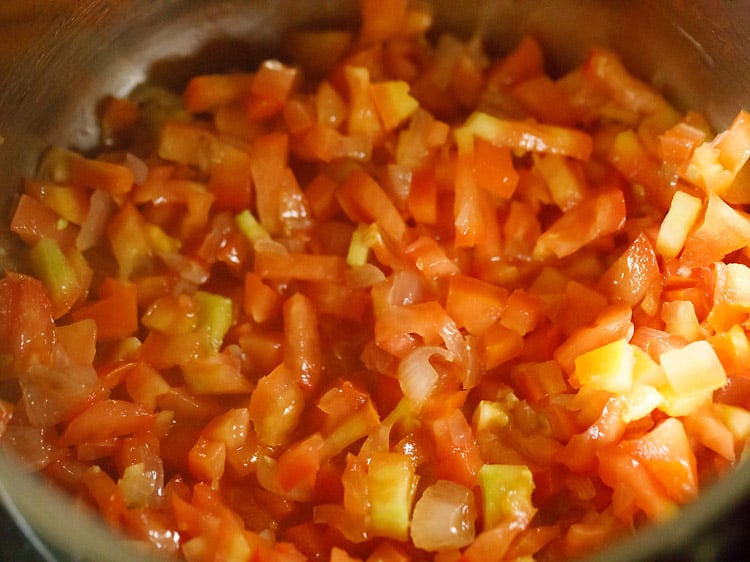 tomatoes, onions, garlic and oil mixed in a pan