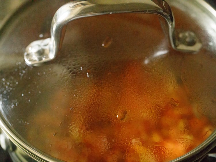 tomatoes, onions, garlic and oil with a lid