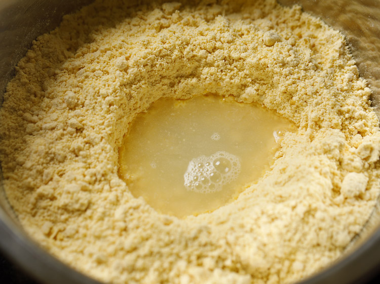 water added in the center of the flour mixture for bhakarwadi recipe. 