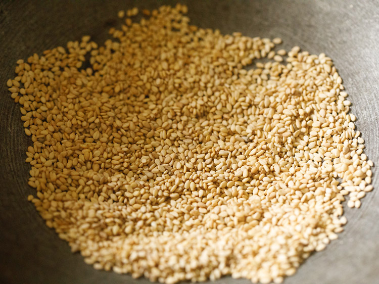 roasting sesame seeds for making stuffing for bhakarwadi recipe. 