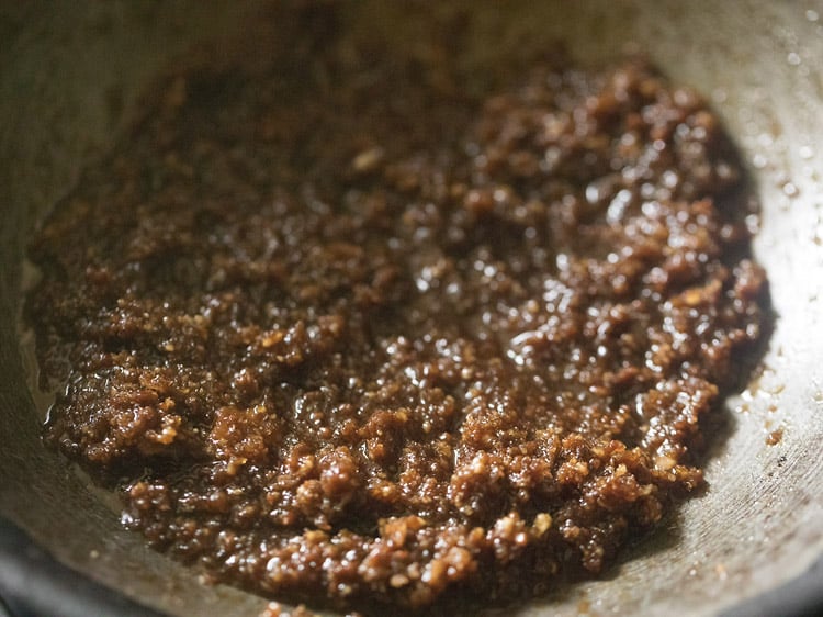 cooking coconut-jaggery mixture.